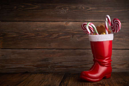 Santa boots with sweets and gifts for St. Nicholas Day on December 6th.の写真素材