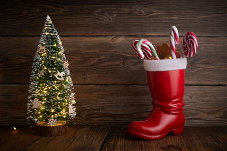 Santa boots with sweets and gifts for St. Nicholas Day on December 6th.の写真素材