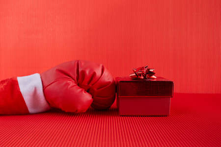 Boxing day shopping creative idea. Boxing glove with gift box.の写真素材