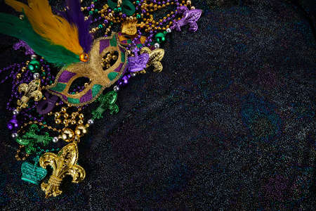 Mardi Gras Mask and colorful Mardi Gras Beads Backgroundの写真素材
