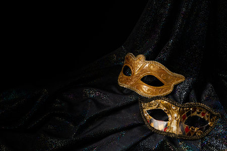 Luxury venetian mask on dark glitter background. Carnival masquerade fantasy maskの写真素材