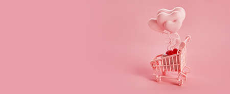 Heart shaped baloons in the pink shopping cart on a pink background. Season sale, spring shoping concept. Valentines day.の写真素材