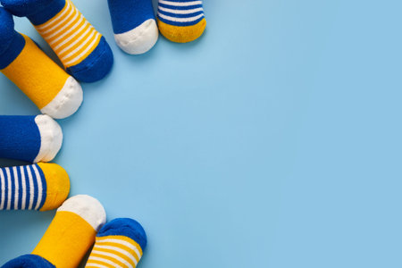 World Down syndrome day background. Down syndrome awareness concept. Socks on blue backgroundの写真素材