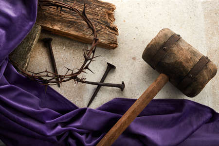 Crucifixion Of Jesus Christ. Cross With three Nails And Crown Of Thorns on groundの写真素材