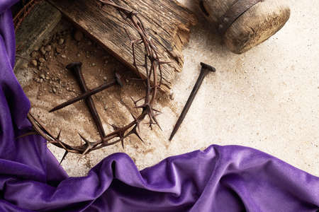 Crucifixion Of Jesus Christ. Cross With three Nails And Crown Of Thorns on groundの写真素材