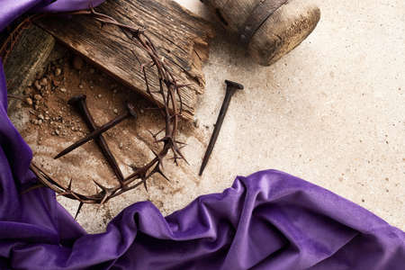 Crucifixion Of Jesus Christ. Cross With three Nails And Crown Of Thorns on groundの写真素材