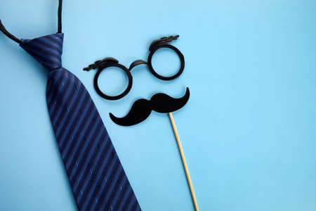 Happy Fathers Day. Set of stylish men accessories on blue background. Fathers Day greeting card, copy space for textの写真素材