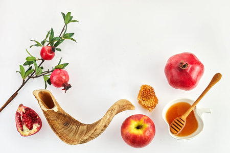 Rosh hashanah, jewish New Year holiday concept. Pomegranate, apples and honey traditional products for celebrationの写真素材
