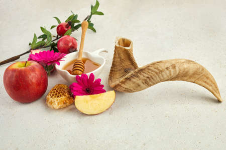Rosh hashanah, jewish New Year holiday concept. Pomegranate, apples and honey traditional products for celebrationの写真素材