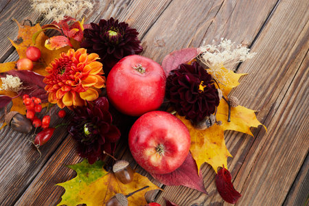 Composition of colorful fruits, berries, cones. Top view on wooden background. Autumn flat lay.の写真素材