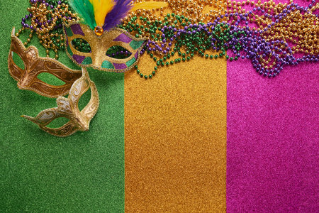 Mardi gras, Venetian or Carnivale mask on on a tricolor shining background.の写真素材