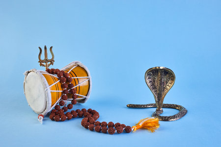 Shivaratri background with Shivas trident, Pellet Drum Damroo musical instrument ans snake . Maha Shivratri festvalの写真素材