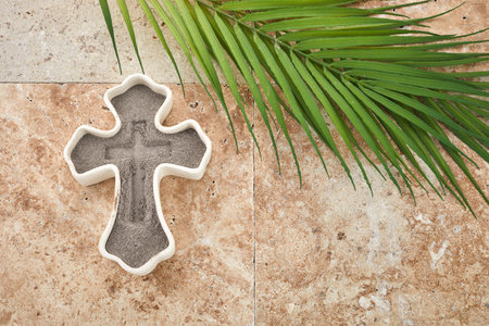 Ash wednesday, crucifix made of ash, dust as christian religion. Lent beginning