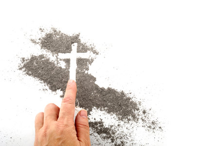 Cross made of ashes, Ash Wednesday, Lent season abstract background.の写真素材