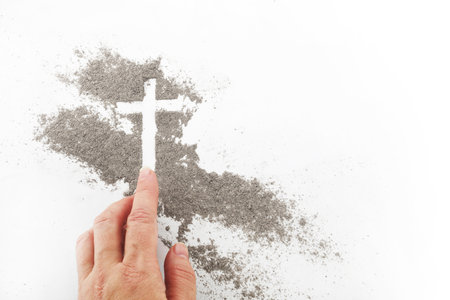 Cross made of ashes, Ash Wednesday, Lent season abstract background.の写真素材