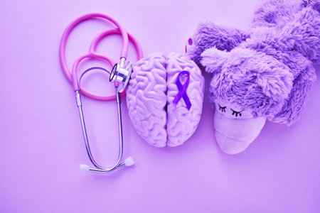 Purple day. Epilepsy awareness day. Toy bear with purple ribbon.の写真素材