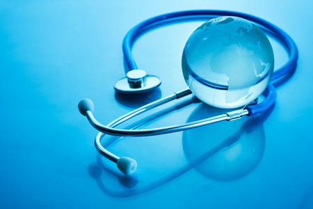 World Health Day. Global Health Awareness Concept. Globe and Stethoscope on blue background.の写真素材