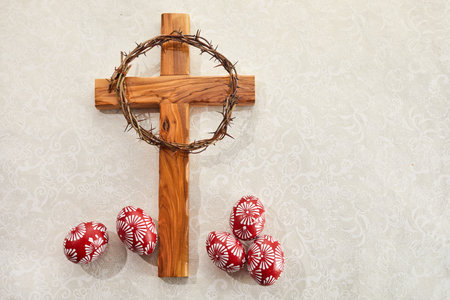 Christian Cross and and Colorful Easter Eggs on vintage backgroundの写真素材