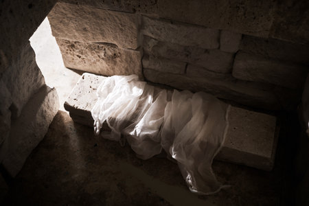 Empty tomb while light shines from the outside. Jesus Christ Resurrection. Christian Easter concept.の写真素材