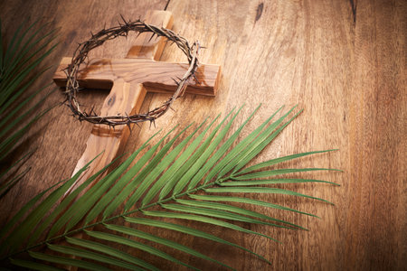Palm sunday background. Cross and palm on vintage background.の写真素材