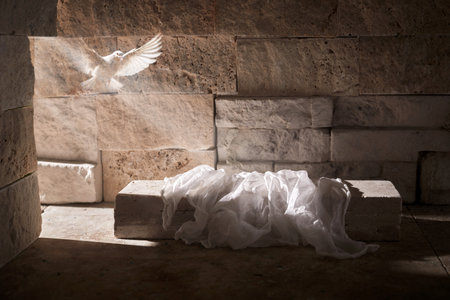 Jesus Christ crucifixion death and resurrection and easter dove flying in a stone tombの写真素材