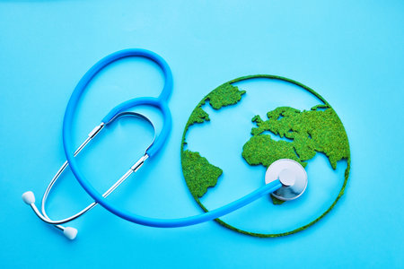 World Health Day. Global Health Awareness Concept. Globe and Stethoscope on blue background.の写真素材