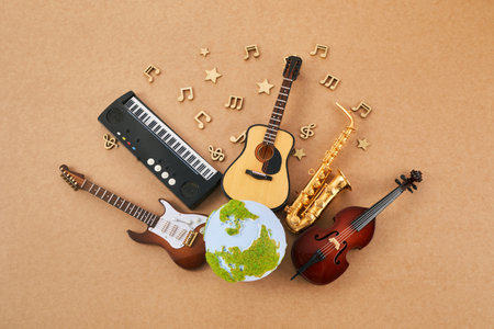 Happy world music day. Musical instruments with globe background.の写真素材