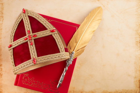 Dutch holiday Sinterklaas background with mitre staff and book of Sinterklaas.の写真素材