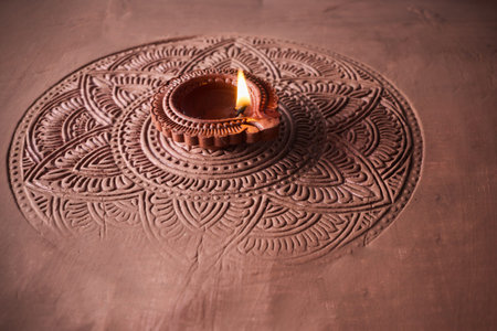 Burning diya on Happy Diwali, background for light festival of India