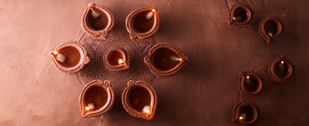 Burning diya on Happy Diwali, background for light festival of India.の写真素材