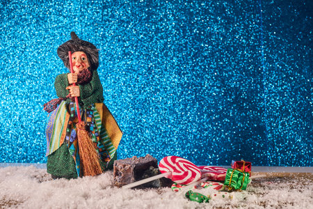The Befana with sweet coal and candy. Italian Epiphany day tradition.の写真素材