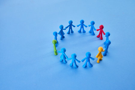Diversity and inclusion concept. Colorful figurines on blue backgroundの写真素材