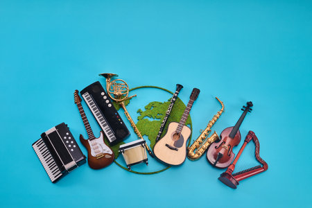 World Music Day. Assortment of Musical Instruments with world map on Blue backgroundの写真素材