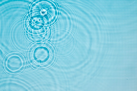 Ripples in Water. Calming ripples in a clear blue swimming pool