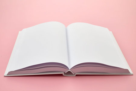 Open Blank Book on Pink Background
