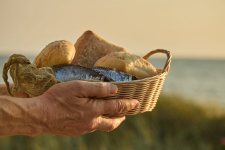 Christianity, religion, Bible concept. Five loaves of bread and two fish