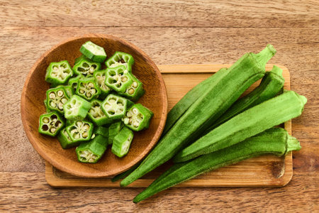 Fresh Okra on Wooden Boardの写真素材