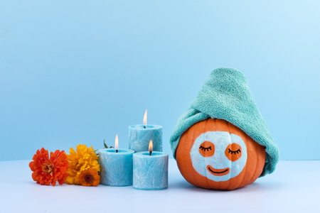 Relaxing Pumpkin Spa. A pumpkin with a towel and face maskの写真素材