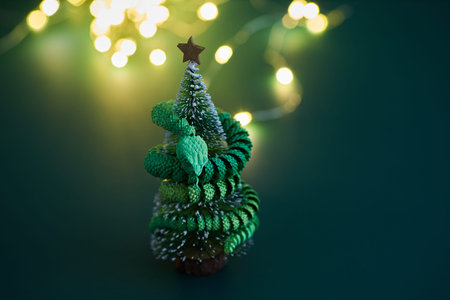 A vibrant green snake intertwined on christmas treeの写真素材