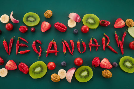 Vegetarian diet month in january called Veganuary. Veganuary word made from red chillies and childish letteringの写真素材