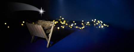 Nativity Scene. A serene nativity scene with a star and fairy lightsの写真素材