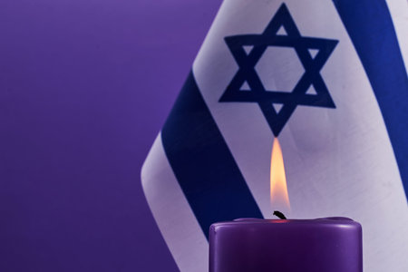 Holocaust memorial day. Candle and Flag