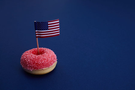 Donut and Flag. A pink donut topped with an American flag