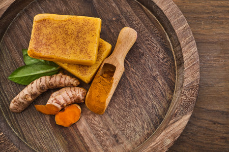 Turmeric Soap and Spice on woodの写真素材