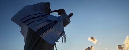 Jewish man blowing the Shofar horn of Rosh Hashanahの写真素材