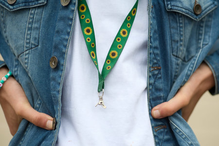 Sunflower lanyard, symbol of people with invisible or hidden disabilities.