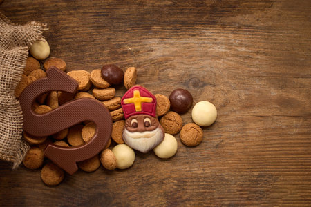 Sinterklaas, St. Nicholas bag filled with a cookies letter S of chocolate and sweetsの写真素材