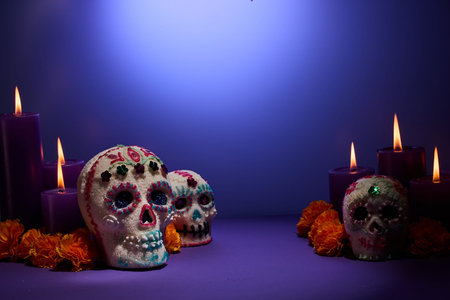Day of the Dead Scene. Decorative sugar skulls with candles and marigolds
