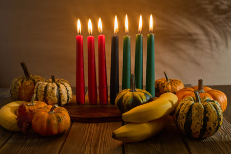 Kwanzaa. African holiday Kwanzaa with decoration of seven candles and pumpkinsの写真素材