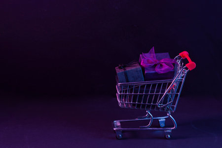 Shopping Scene. Gift in Shopping Cart. A small shopping cart containing giftsの写真素材